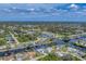 Beautiful aerial view of waterfront community with canal access and lush landscaping at 18390 Burkholder Cir, Port Charlotte, FL 33948