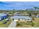 Aerial view of house with boat and waterfront access at 18390 Burkholder Cir, Port Charlotte, FL 33948