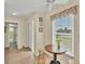 Inviting breakfast nook with natural light, tile floors, and stool seating at 18390 Burkholder Cir, Port Charlotte, FL 33948