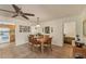 Dining room showcasing tile floors, natural light, and seating for six at 18390 Burkholder Cir, Port Charlotte, FL 33948