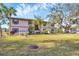 Two-story building with a well-maintained lawn at 19505 Quesada Ave # Jj101, Port Charlotte, FL 33948