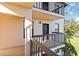 Balcony with black railings offering a pleasant outdoor space with a building entry door at 1999 Kings Hwy # 16B, Punta Gorda, FL 33980