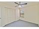 Comfortable bedroom boasts a large window, ceiling fan and a spacious double-door closet at 1999 Kings Hwy # 16B, Punta Gorda, FL 33980