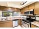 Kitchen featuring stainless steel appliances and a tile backsplash at 1999 Kings Hwy # 16B, Punta Gorda, FL 33980