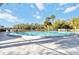 Large community pool surrounded by palm trees, providing a refreshing escape on a sunny day at 1999 Kings Hwy # 16B, Punta Gorda, FL 33980