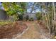 Landscaped backyard with mature plants and shrubs at 2202 Gold Oak Ln, Sarasota, FL 34232