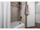 Updated bathroom with a shower/tub combo and built-in shelving at 2202 Gold Oak Ln, Sarasota, FL 34232