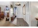 Bright entryway with gray flooring and white louvered closet at 2202 Gold Oak Ln, Sarasota, FL 34232