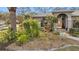 Landscaped front yard with mature plants and shrubs at 2202 Gold Oak Ln, Sarasota, FL 34232