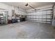 Garage with overhead storage and ample space for vehicles at 2202 Gold Oak Ln, Sarasota, FL 34232