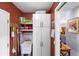 Bright laundry room with storage cabinets and a utility sink at 2202 Gold Oak Ln, Sarasota, FL 34232