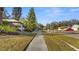 Residential street view showcasing homes and landscaping at 2202 Gold Oak Ln, Sarasota, FL 34232