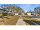 Residential street view showcasing homes and landscaping at 2202 Gold Oak Ln, Sarasota, FL 34232