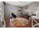 Home office with wood floors and a circular rug at 2202 Gold Oak Ln, Sarasota, FL 34232