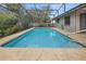 Inviting swimming pool with a large, screened patio area at 2202 Gold Oak Ln, Sarasota, FL 34232