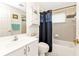 Bathroom with tub, vanity, and shower, offering a functional space at 24117 Buckingham Way, Punta Gorda, FL 33980