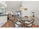 Small dining area with glass-top table and wicker chairs at 24117 Buckingham Way, Punta Gorda, FL 33980