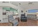 Living room with comfortable seating and a view into the kitchen at 24117 Buckingham Way, Punta Gorda, FL 33980