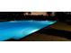 Night view of a well-lit community pool at 24117 Buckingham Way, Punta Gorda, FL 33980