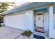 House exterior featuring a two-car garage and welcoming entrance at 2455 Pellam Blvd, Port Charlotte, FL 33948