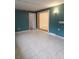 Additional room with teal walls and access to the living area at 2461 Ivanhoe St, Port Charlotte, FL 33952