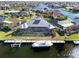 Waterfront home with boat dock, boat lift, and lush landscaping at 2580 Brazilia Ct, Punta Gorda, FL 33950