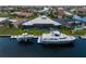 Stunning waterfront estate featuring a private dock with boat lift, perfect for boating enthusiasts at 2580 Brazilia Ct, Punta Gorda, FL 33950