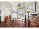 Elegant foyer with hardwood floors, high ceilings, transom window and a decorative chandelier at 2580 Brazilia Ct, Punta Gorda, FL 33950