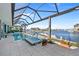 Relaxing pool with water views from the screened lanai, an ideal spot for waterfront enjoyment at 2580 Brazilia Ct, Punta Gorda, FL 33950