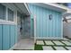 Private outdoor shower with blue siding and stone tile at 2726 N Beach Rd, Englewood, FL 34223