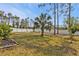 Large backyard with grassy area and privacy fence at 3189 Tally Ho Rd, North Port, FL 34291