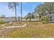 Backyard with firepit and winding path at 3189 Tally Ho Rd, North Port, FL 34291