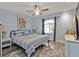 Spacious primary bedroom with ceiling fan and large window at 3189 Tally Ho Rd, North Port, FL 34291