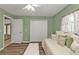 Charming bedroom with daybed, built-in closet, and access to hallway at 3189 Tally Ho Rd, North Port, FL 34291