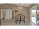 Dining area with table and chairs, near kitchen at 3189 Tally Ho Rd, North Port, FL 34291