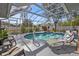 Inviting screened pool with lounge chairs at 3189 Tally Ho Rd, North Port, FL 34291