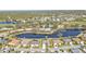 Community overview featuring houses around a lake at 3380 Bay Ridge Way, Port Charlotte, FL 33953