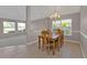 Bright dining room with a view and wood table at 3380 Bay Ridge Way, Port Charlotte, FL 33953