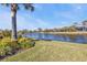 Scenic waterfront view with lush landscaping at 3380 Bay Ridge Way, Port Charlotte, FL 33953