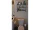 Full bathroom with toilet and shelving unit at 3380 Maple Ter, Port Charlotte, FL 33952