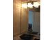 Bathroom with modern vanity, sink, and lighting at 3380 Maple Ter, Port Charlotte, FL 33952