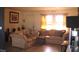 Cozy living room with neutral colored couches and tile floors at 3380 Maple Ter, Port Charlotte, FL 33952