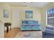 Small bedroom with daybed, hardwood floors, and art at 3533 Lakewood Blvd, North Port, FL 34287