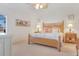 Spacious bedroom with king-size bed and access to a patio at 3533 Lakewood Blvd, North Port, FL 34287