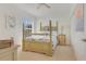 Bedroom with a light-colored wooden bed frame and coastal-themed art at 3533 Lakewood Blvd, North Port, FL 34287