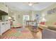 Living room with hardwood floors, sofas, and view to kitchen at 3533 Lakewood Blvd, North Port, FL 34287