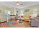 Living room with light walls, hardwood floors, and sofas at 3533 Lakewood Blvd, North Port, FL 34287