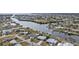 Aerial view showing home's location on canal with neighborhood context at 407 Dunn Ne Dr, Port Charlotte, FL 33952