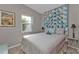 Bedroom with full-size bed and window seat at 407 Dunn Ne Dr, Port Charlotte, FL 33952