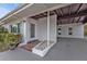 Inviting house entrance with brick detailing and covered walkway at 407 Dunn Ne Dr, Port Charlotte, FL 33952